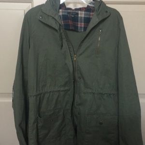 Green hooded jacket with plaid details